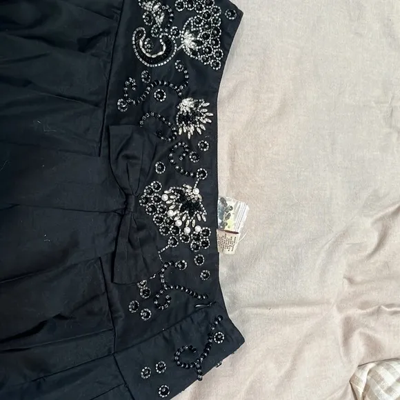Free People black beaded, pleated skirt with bow front