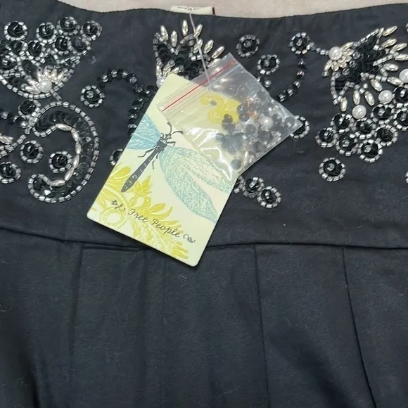 Free People black beaded, pleated skirt with bow front