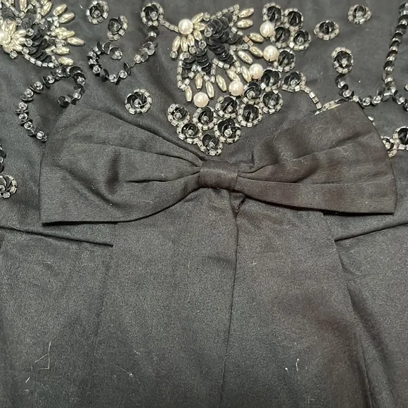 Free People black beaded, pleated skirt with bow front