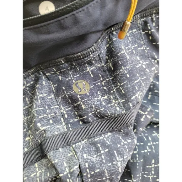 Lululemon Women's 4 Pace Setter Tennis Skirt Navy Print Lined Vented Pleated