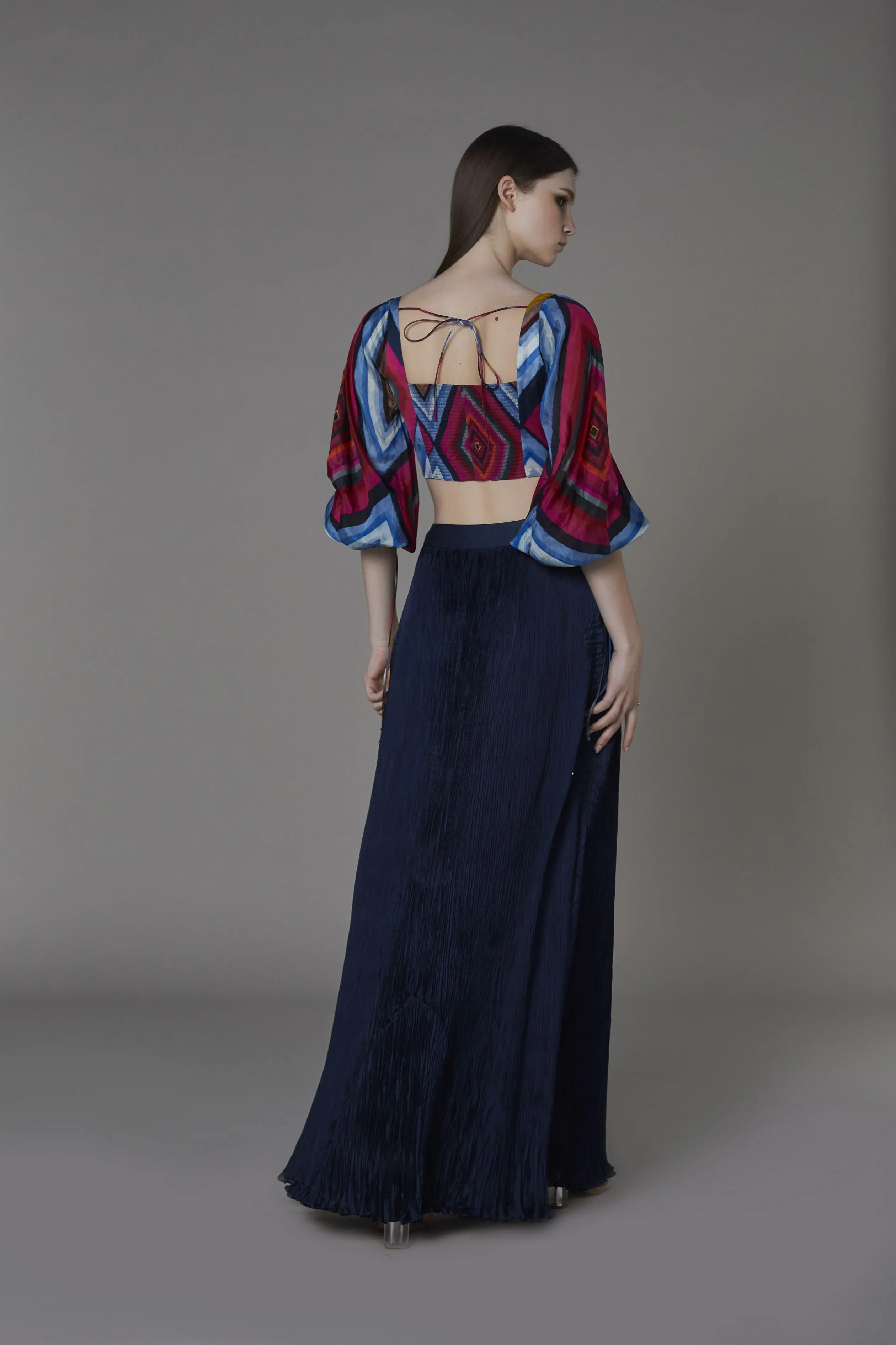 Saaksha & KinniÂ    I   Pink blue big diamond bustier with attached balloon sleeves  Navy blue non print pleated skirt Blouse - Satin  Skirt - Chiffon Blouse - Pink / blue  Skirt - Navy Blue   SS22102    SS22103